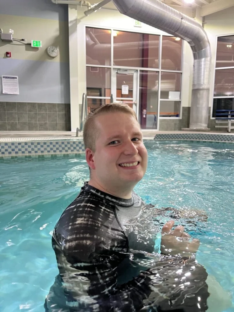 A young person standing in water