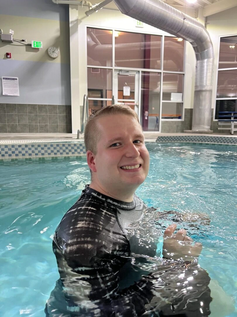 A young person standing in water